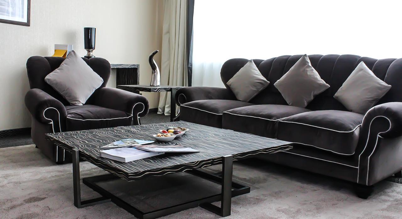 Grand Mogador City Center Casablanca Exterior foto A living room